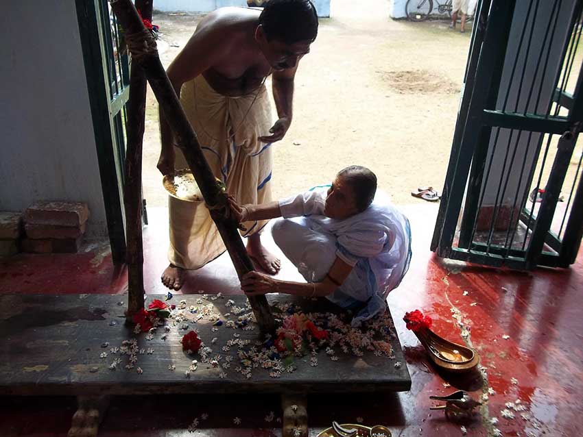 Eldest Daughter in law putting first clay to patt