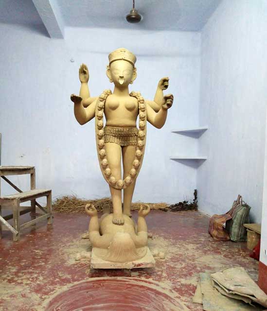 The clay idol being finally prepared