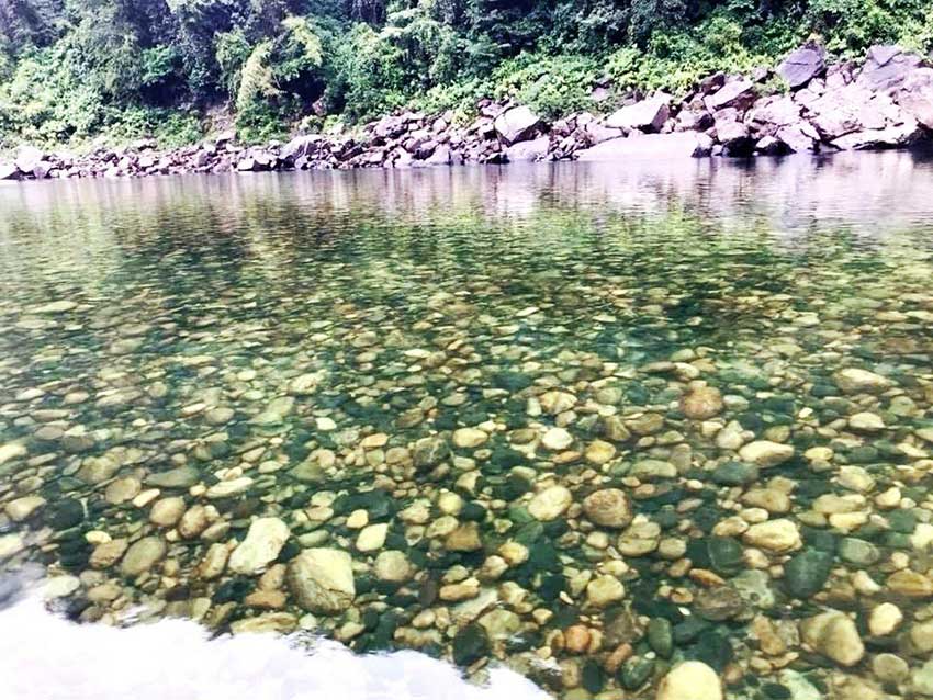 The clear water of Umngot River