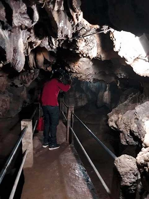 Wooden bridge across the deep central portion of the cave