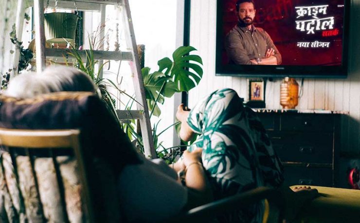 Girl watching "Crime Patrol" on TV
