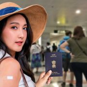 Girl with passport in the immigration canter of Hanoi, Vietnam