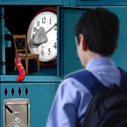 A chair with a furry tail and a wall clock with a big grey nose in a school's locker found by a boy