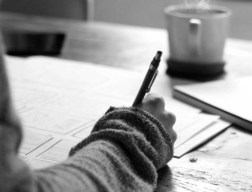 Man writing letter on a winter morning