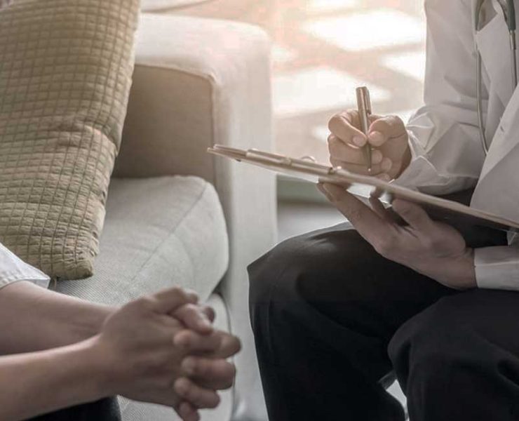 The patient sitting with a Psychiatrist