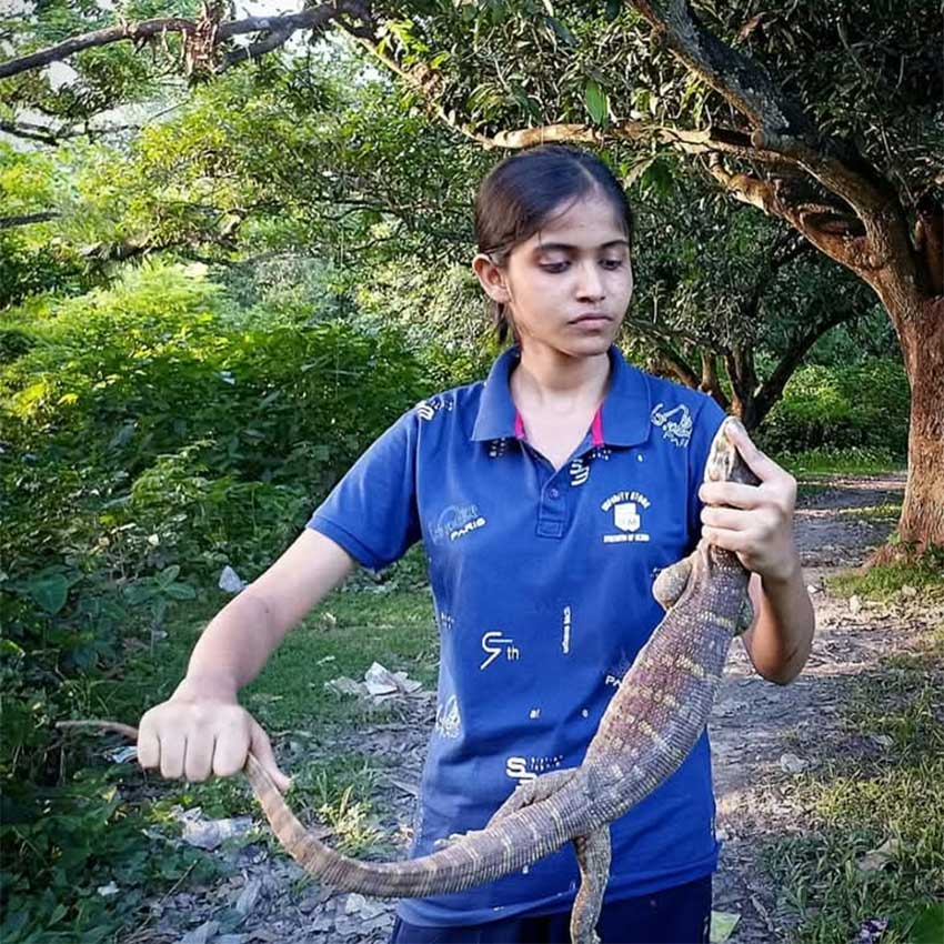 Aditi holding a reptile