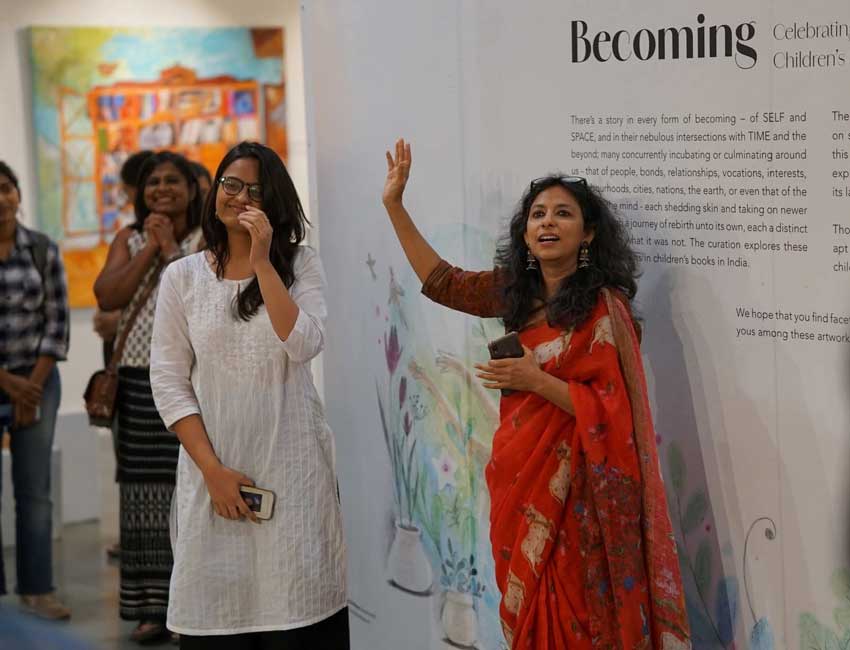 Richa Jha explaining the concept of her exhibition 'Becoming'